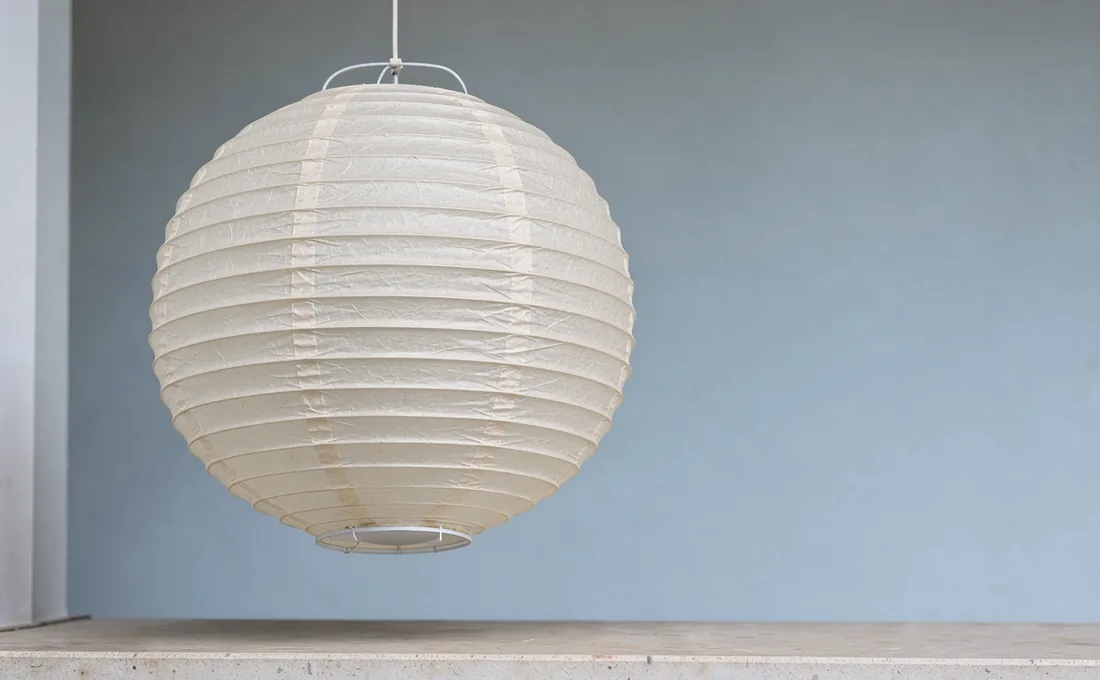 Daylight showing the texture of an unlettered cream lantern